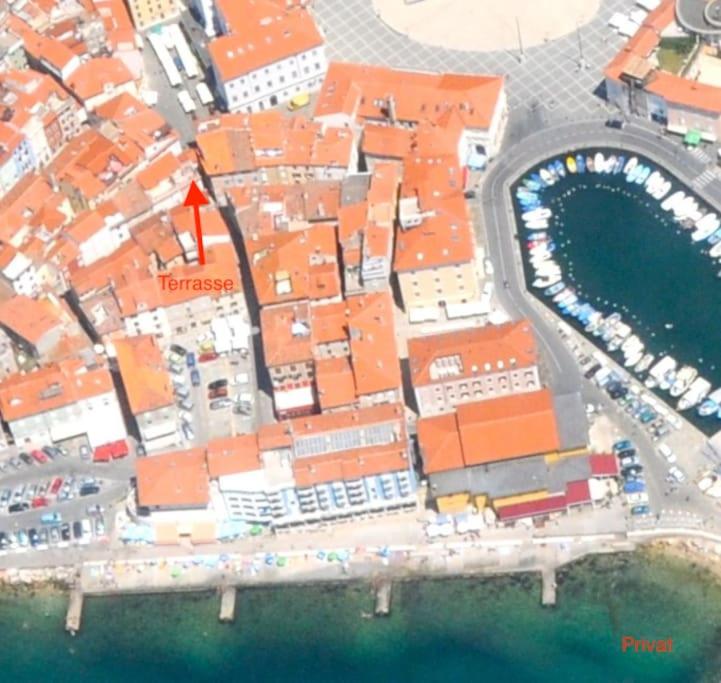 an aerial view of a city with a harbor at Tartini - private roof terrace - self check-in in Piran