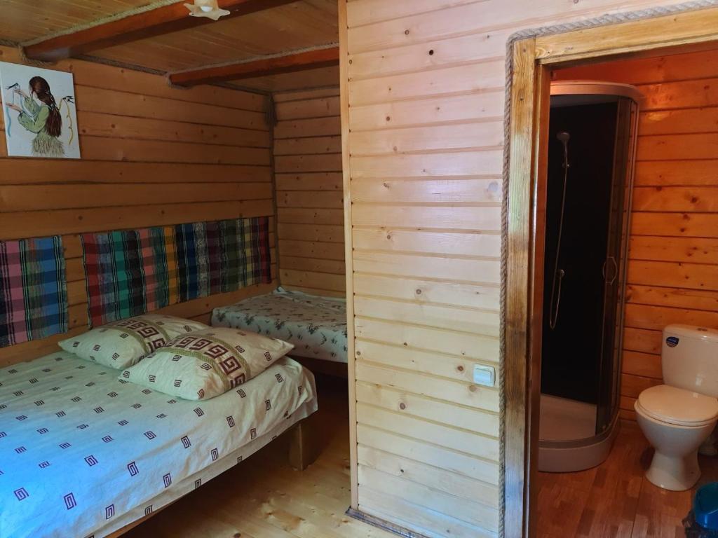 Postel nebo postele na pokoji v ubytování Крайня Хата