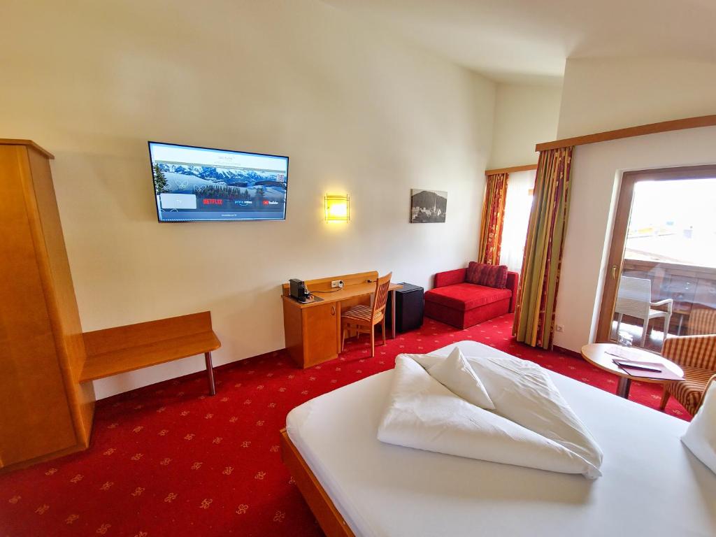 Postelja oz. postelje v sobi nastanitve Das Alpin - Hotel Garni Guesthouse
