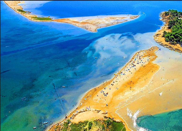 an aerial view of an island in the water at Apartments Linic in Nin
