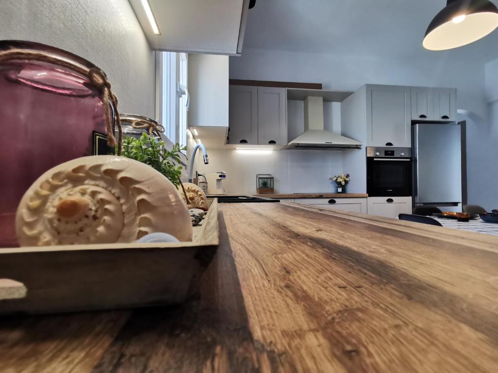 a kitchen with a wooden counter top in a room at Mantalena's house in Antiparos