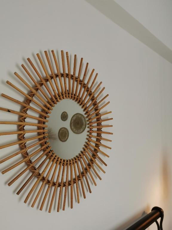 a mirror on a ceiling with a circle in the middle at Mantalena's house in Antiparos