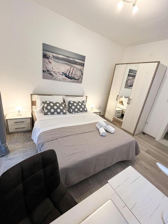 Posteľ alebo postele v izbe v ubytovaní Apartments T&T