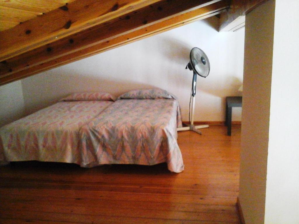 Posteľ alebo postele v izbe v ubytovaní Apartamentos Siglo XXI - Ancla