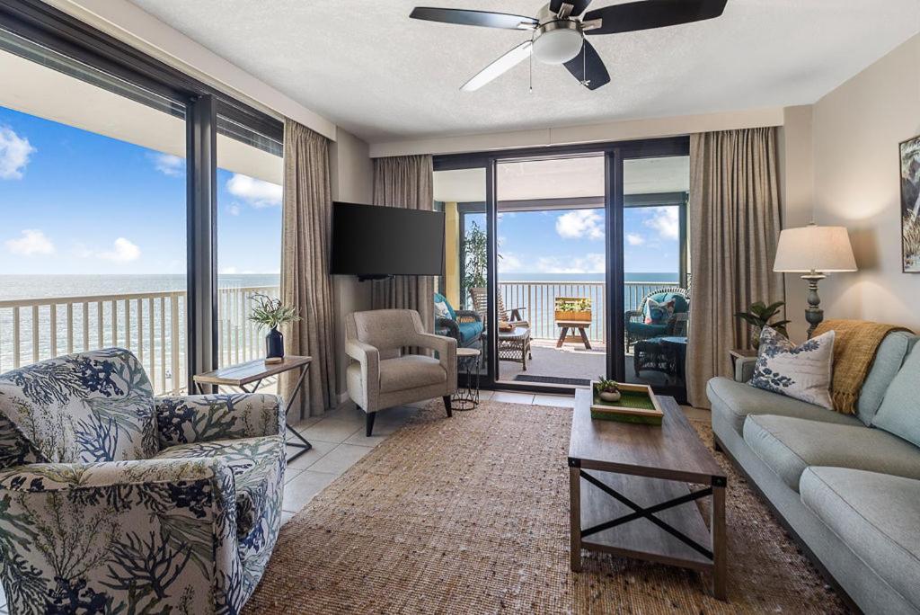 a living room with a view of the ocean at Summer House 901A by ALBVR - Gorgeous Beachfront Corner Condo with Incredible Views in Orange Beach