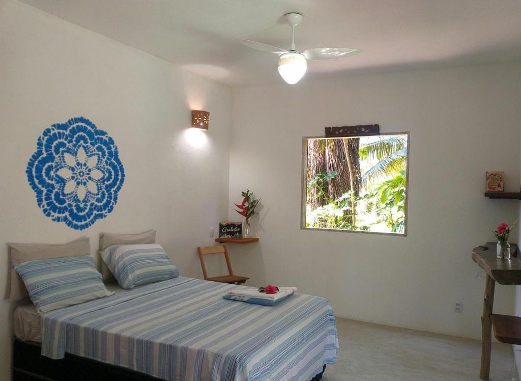 En eller flere senger på et rom på Flor da Ilha Flats