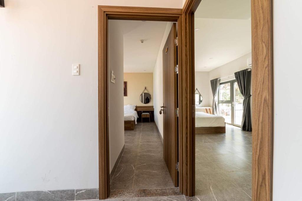 Postel nebo postele na pokoji v ubytování Sweet Home gần bãi sau