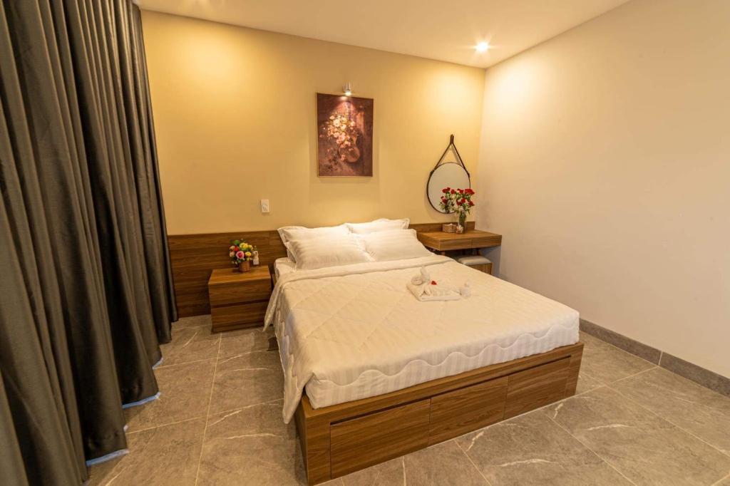 Postel nebo postele na pokoji v ubytování Sweet Home gần bãi sau