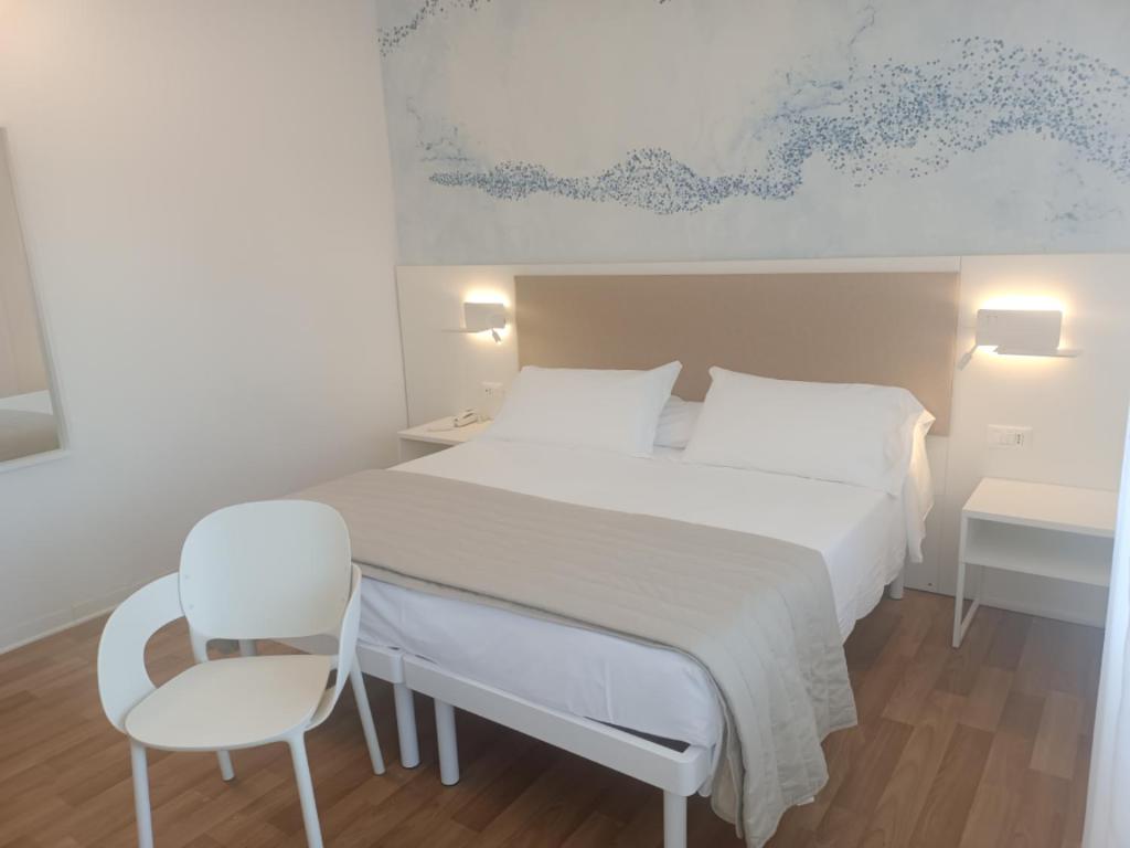 Postel nebo postele na pokoji v ubytování Hotel Splendid