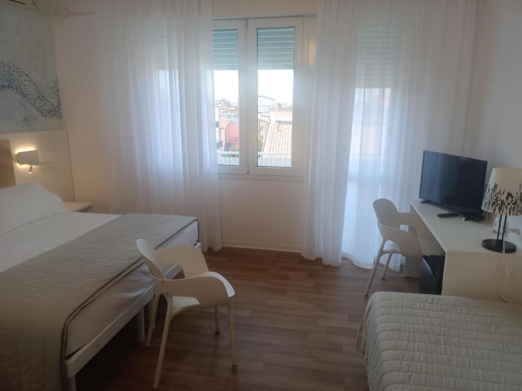Postel nebo postele na pokoji v ubytování Hotel Splendid