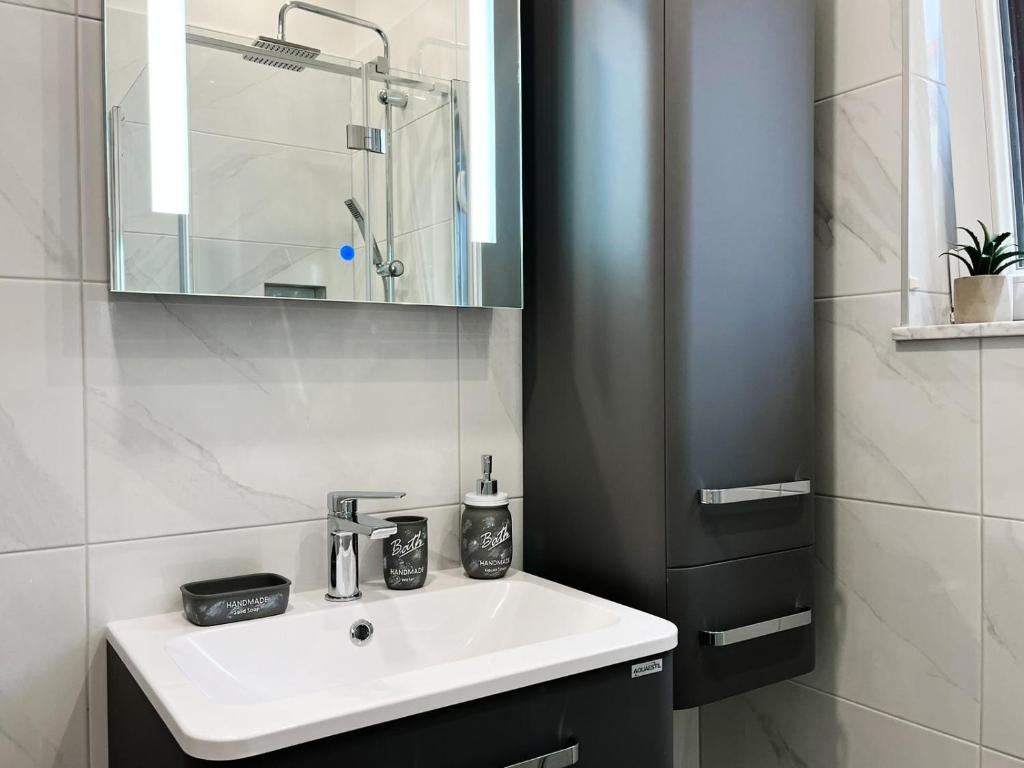 Kúpeľňa v ubytovaní Apartments T&T