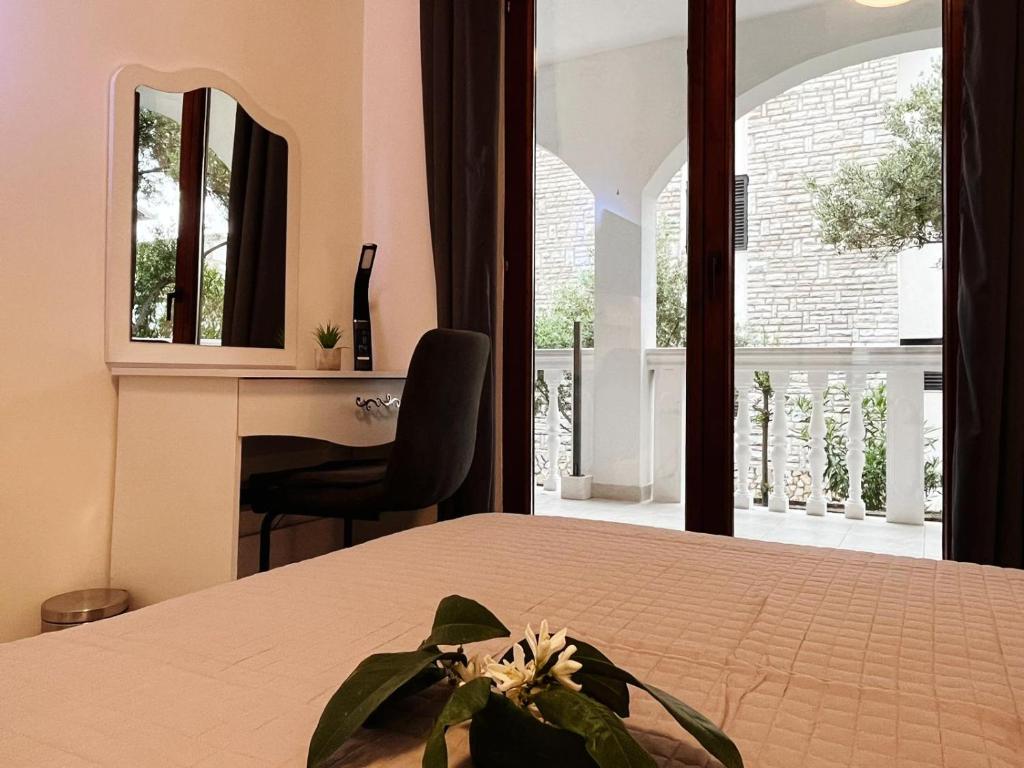 Posteľ alebo postele v izbe v ubytovaní Apartments T&T