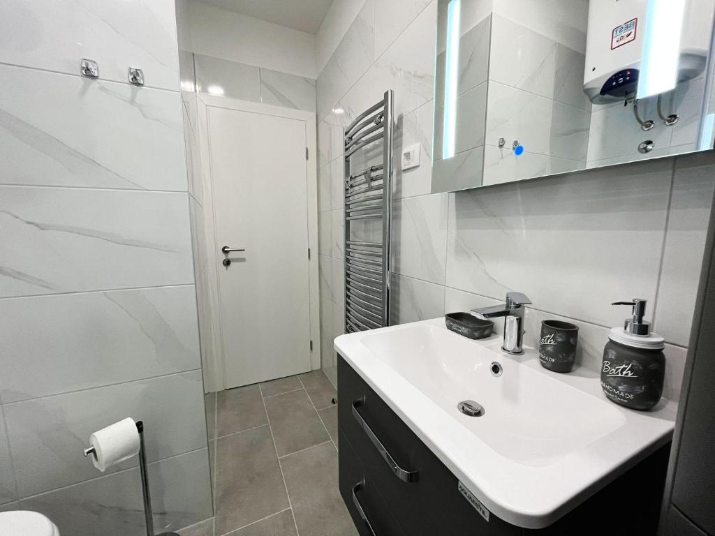 Kúpeľňa v ubytovaní Apartments T&T