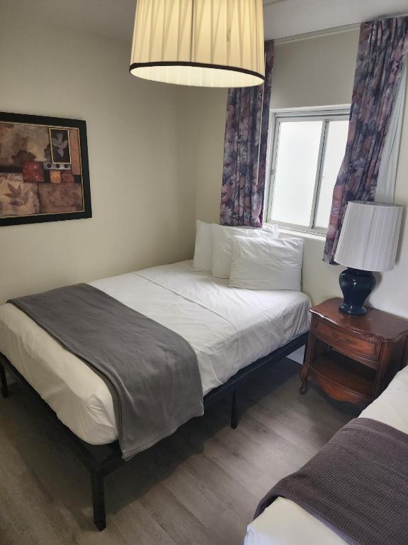 Postel nebo postele na pokoji v ubytování Yankee Clipper Resort Motel