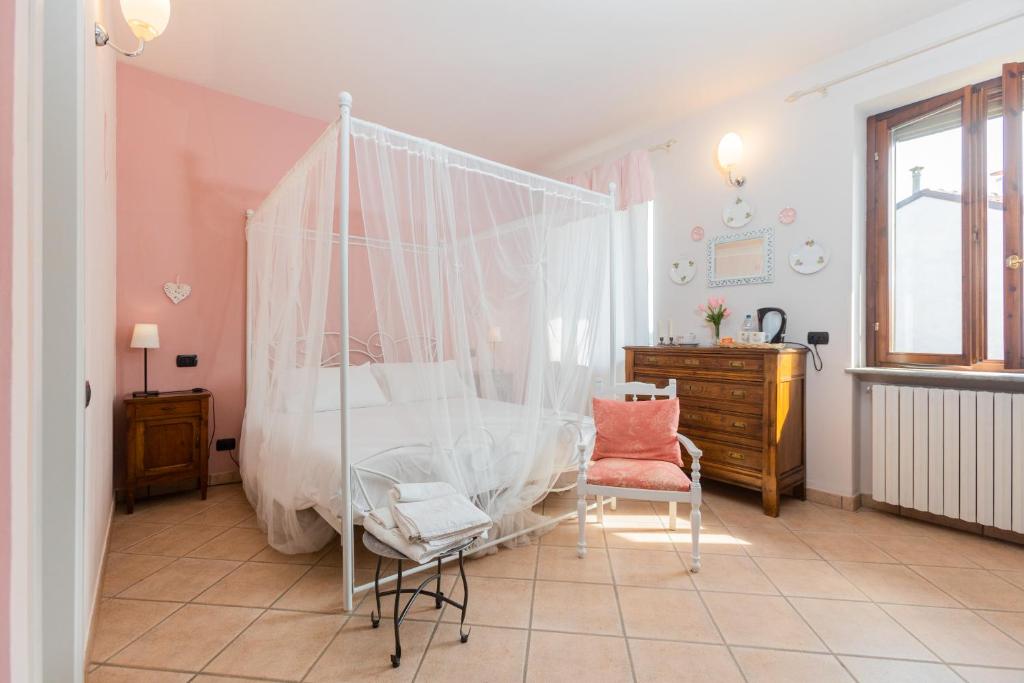 Postel nebo postele na pokoji v ubytování B&B esclusivo, nel cuore del Monferrato