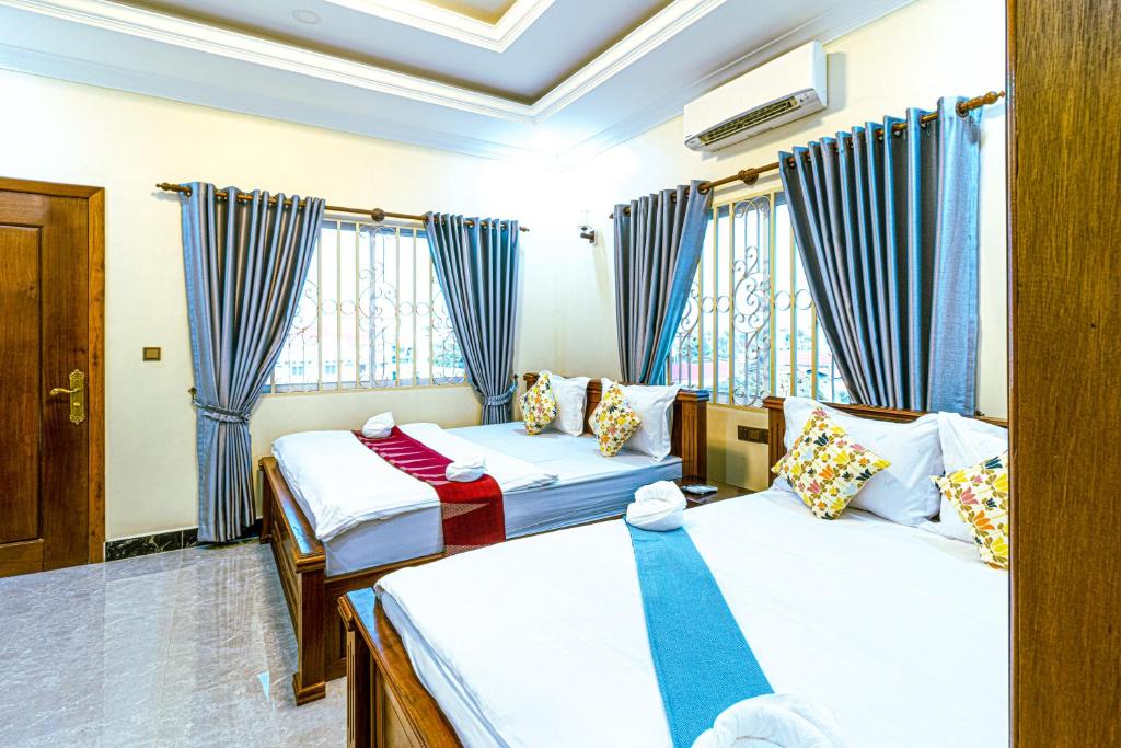 Postel nebo postele na pokoji v ubytování Seagull Guesthouse Kampot