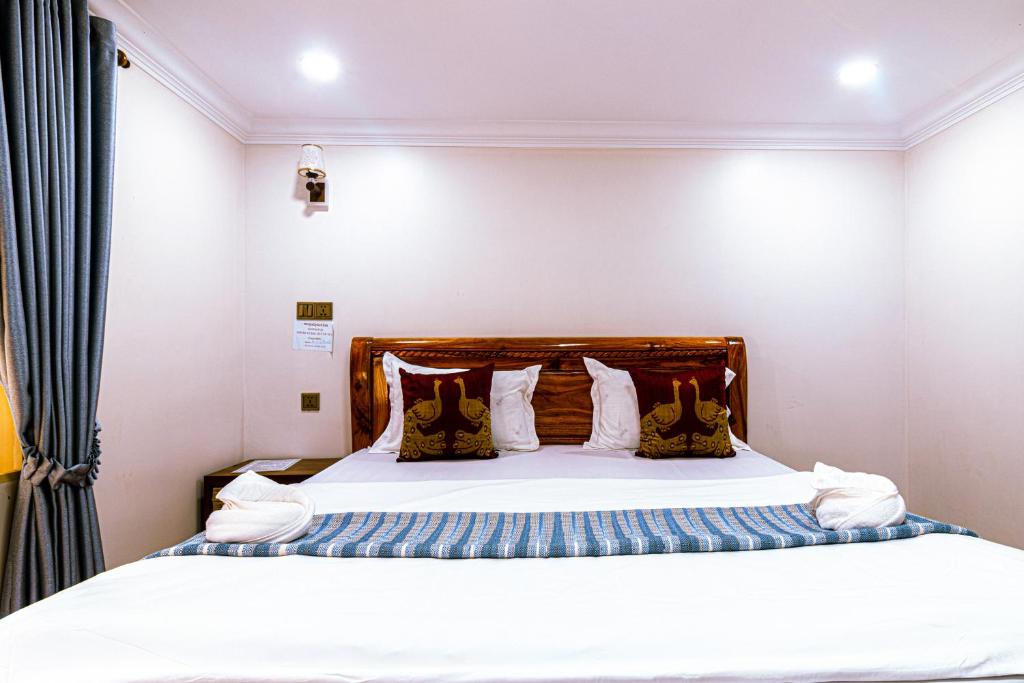 Postel nebo postele na pokoji v ubytování Seagull Guesthouse Kampot