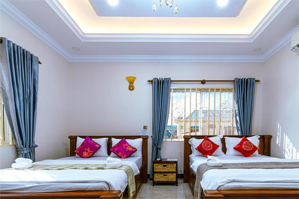 Postel nebo postele na pokoji v ubytování Seagull Guesthouse Kampot