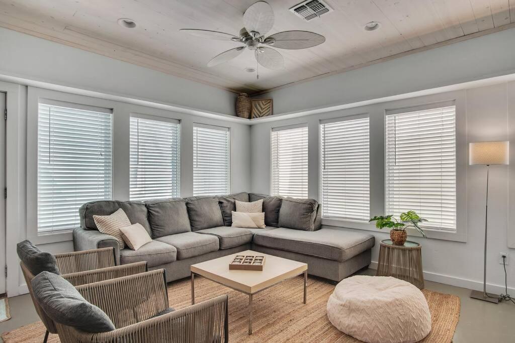 a living room with a couch and a table at Classy 4BDRM Home W/Pool Mins To Beach and Shops! in Port Aransas