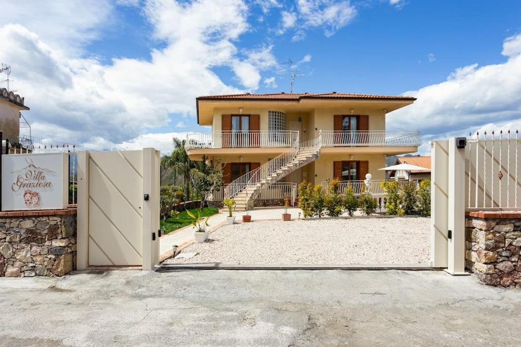 a house with a gate in front of it at Villa Graziosa in Trappitello