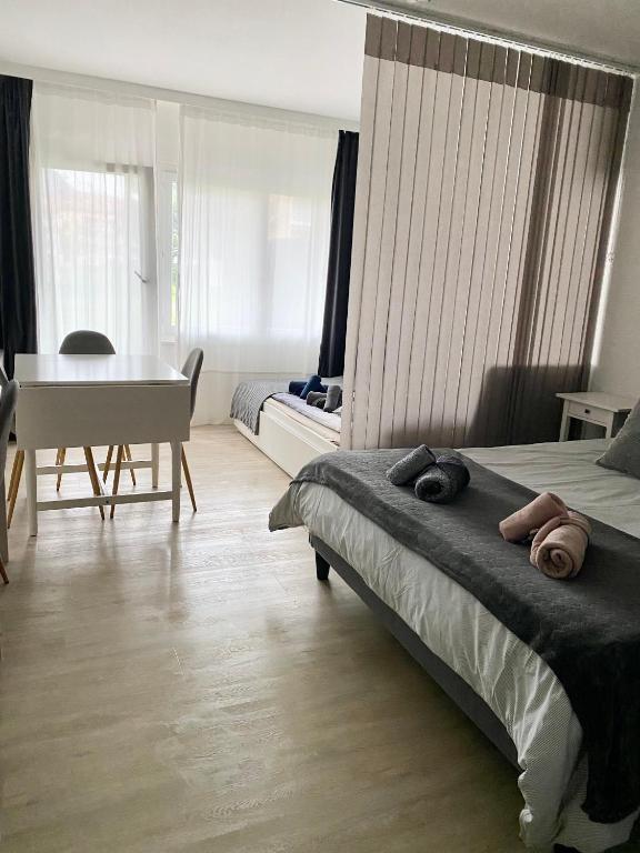 Postel nebo postele na pokoji v ubytování Studio 4pers aux Bains de Saillon