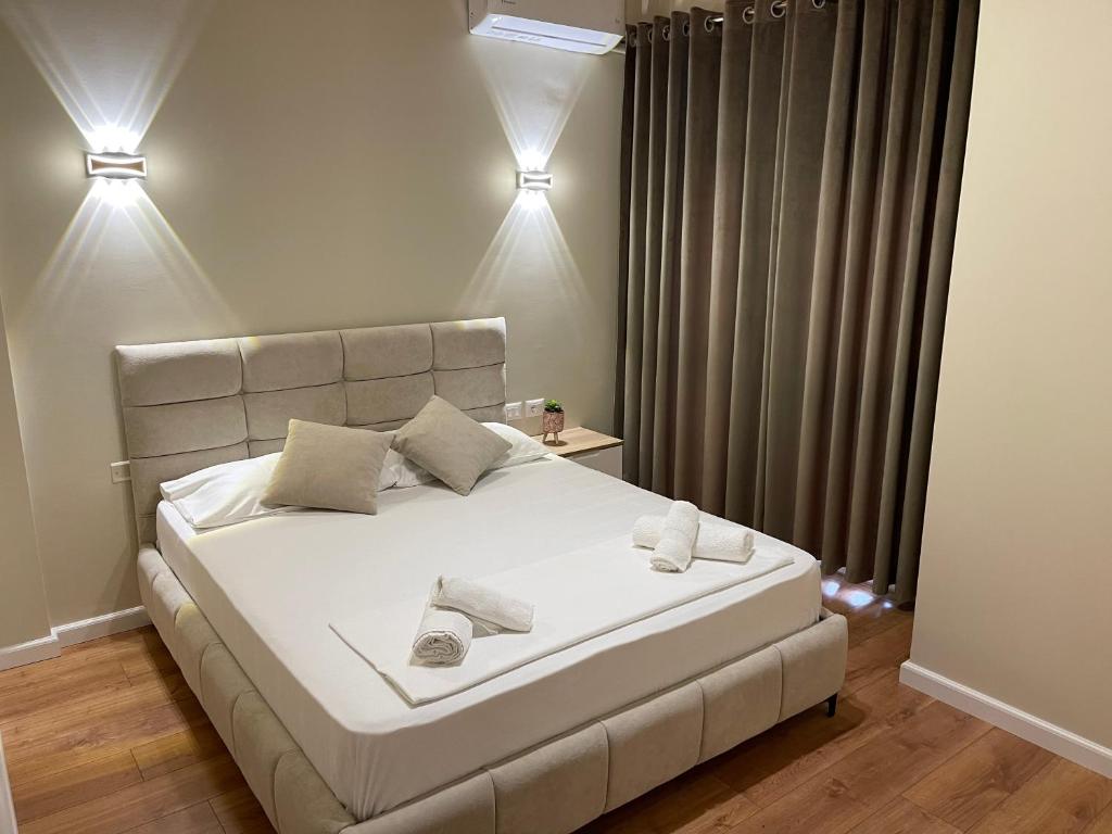 Postel nebo postele na pokoji v ubytování Arial Penthouse Suites
