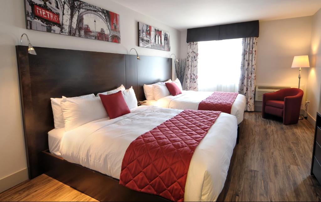 Postel nebo postele na pokoji v ubytování Hôtel Le Floral