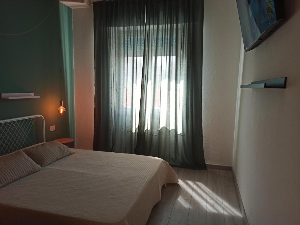 Postel nebo postele na pokoji v ubytování BB Arcana