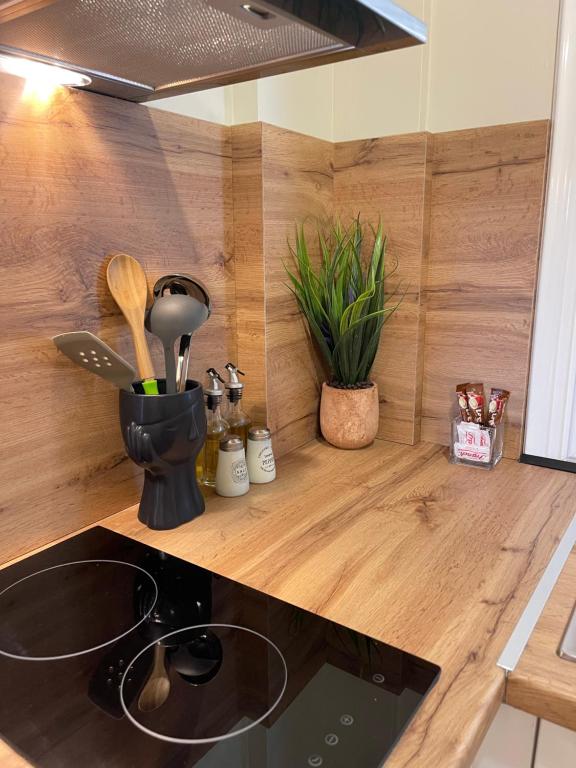 a kitchen with a counter top with a stove top oven at Vila Arial in Vlorë