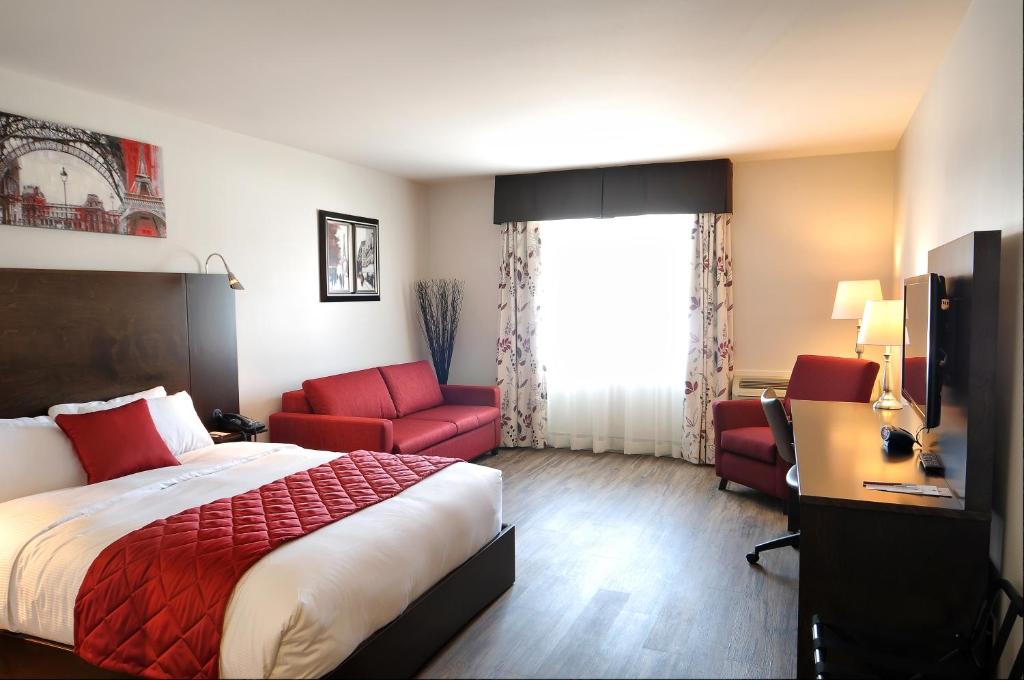 Postel nebo postele na pokoji v ubytování Hôtel Le Floral