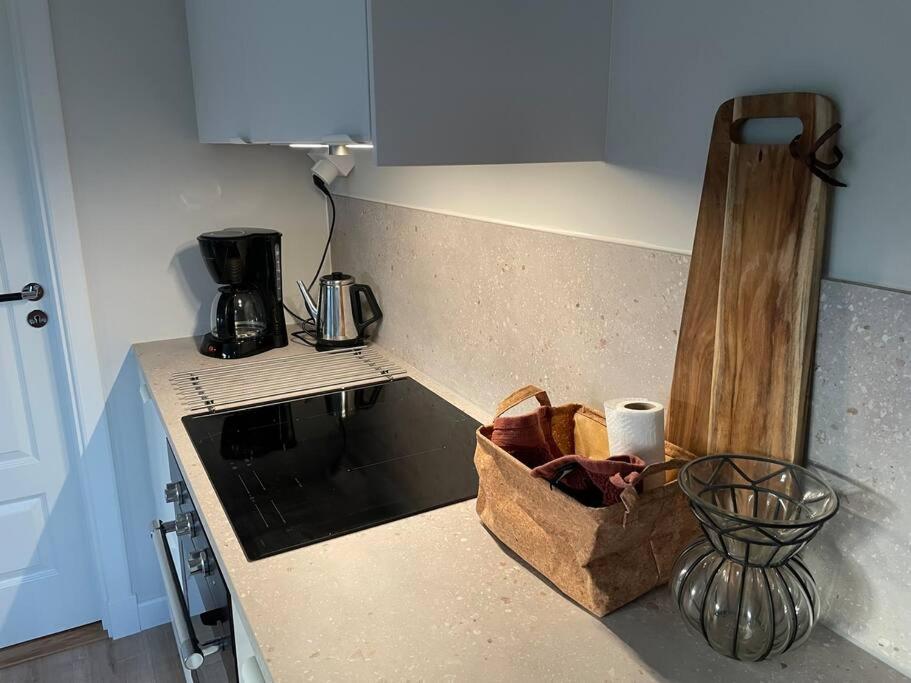 a kitchen with a counter top with a box on it at Ny lägenhet i Vesene in Ljung