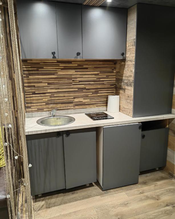 Kuchyň nebo kuchyňský kout v ubytování Apartman OGLEDALO