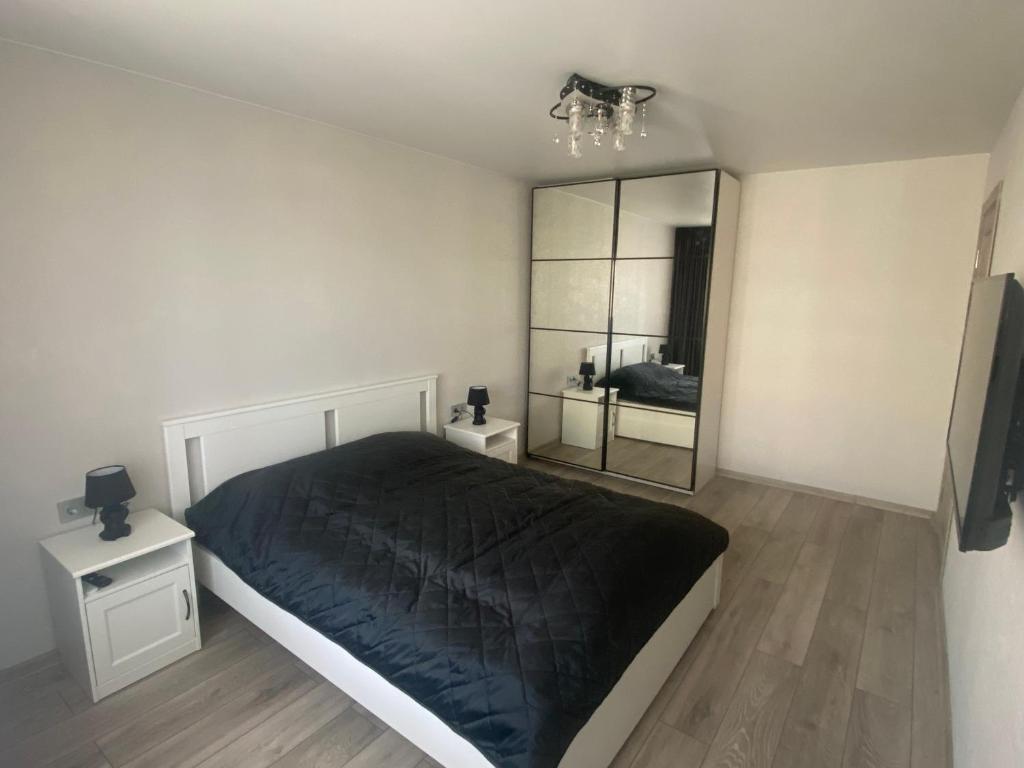 Llit o llits en una habitació de DAK apartament