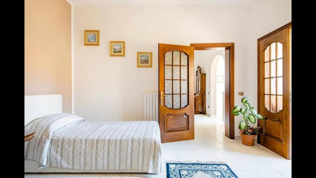 Postel nebo postele na pokoji v ubytování B&B Maison Rosetta IUN-E4948