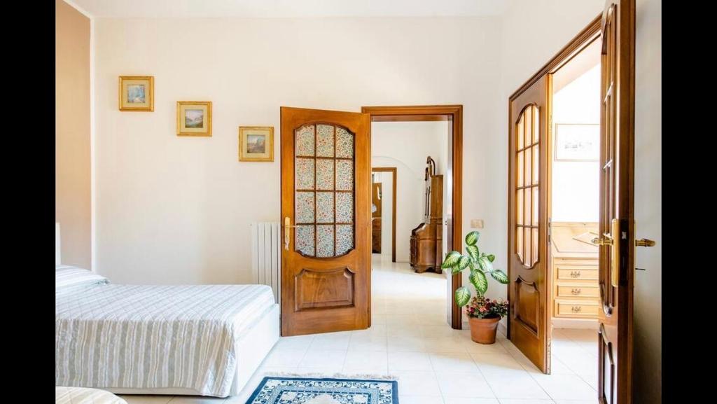 Postel nebo postele na pokoji v ubytování B&B Maison Rosetta IUN-E4948