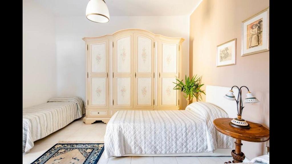 Postel nebo postele na pokoji v ubytování B&B Maison Rosetta IUN-E4948