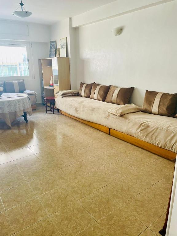 a large couch in a living room with at STAR APPARTEMENT GAUTHIER in Casablanca