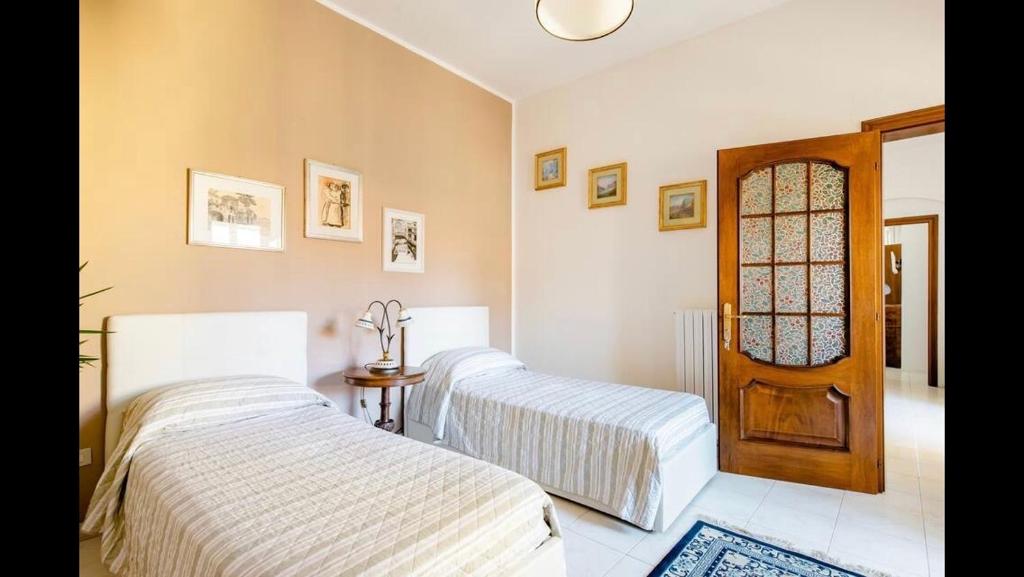 Postel nebo postele na pokoji v ubytování B&B Maison Rosetta IUN-E4948