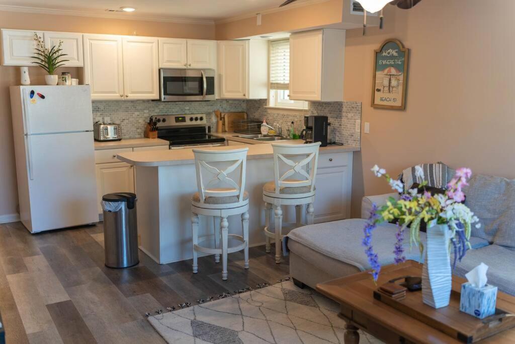 a kitchen and living room with a couch and a refrigerator at North Ocean city newly Remodeled in Ocean City