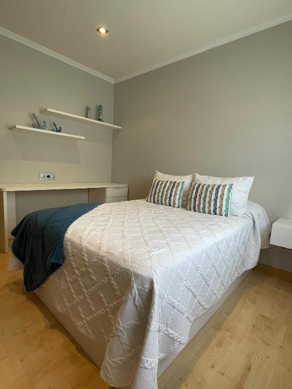 Posteľ alebo postele v izbe v ubytovaní Apartamento D'As Baladas