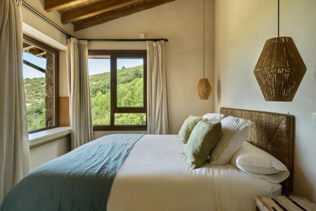 Postel nebo postele na pokoji v ubytování Cerrás Agroturismo