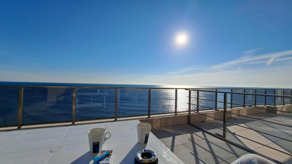 a balcony on a cruise ship looking at the ocean at Diamond Beach Luxus Apart Obzor 28 in Obzor