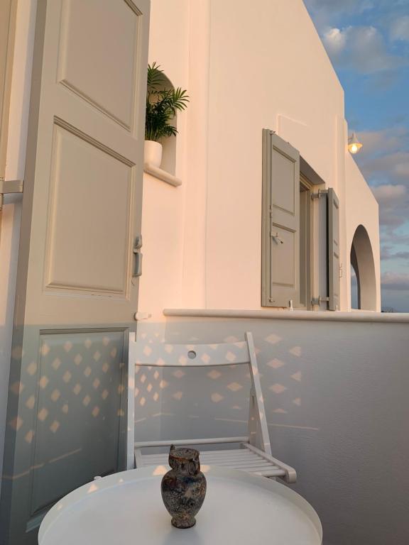 a vase sitting on a white table in a room at Sea and Salt Naxos 3 in Kastraki Naxou