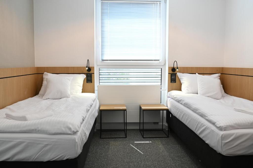 Letto o letti in una camera di Hotel Parrot