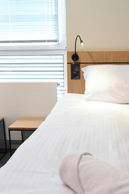 Letto o letti in una camera di Hotel Parrot