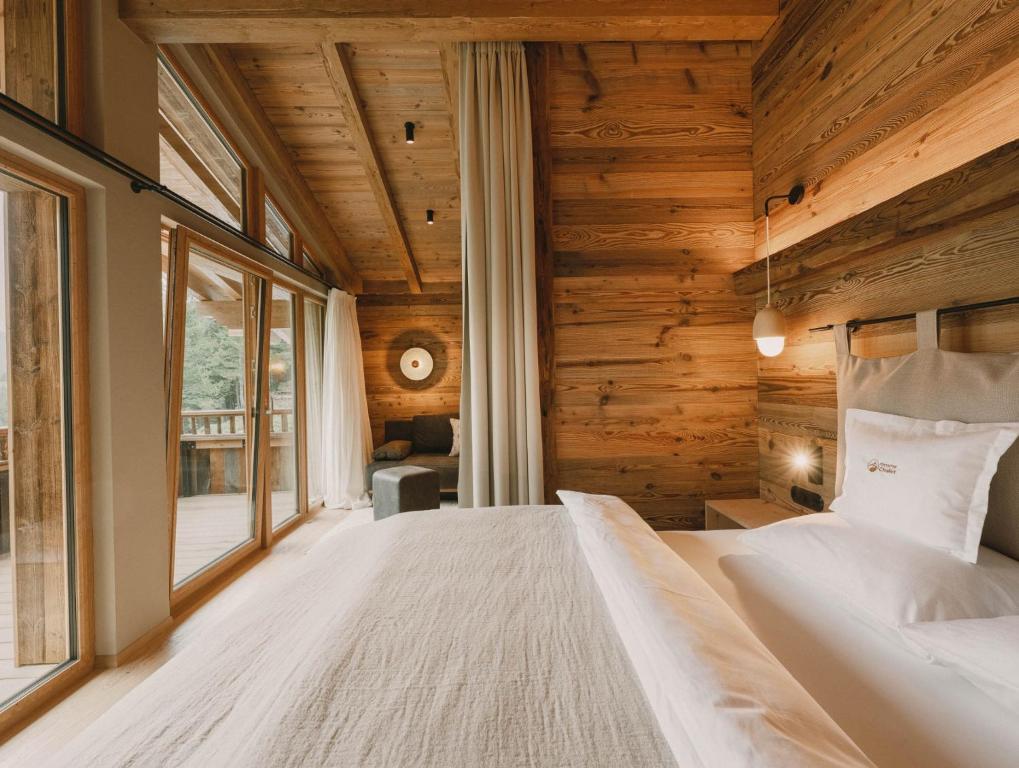 Postel nebo postele na pokoji v ubytování Gletscher-Chalet Stubai