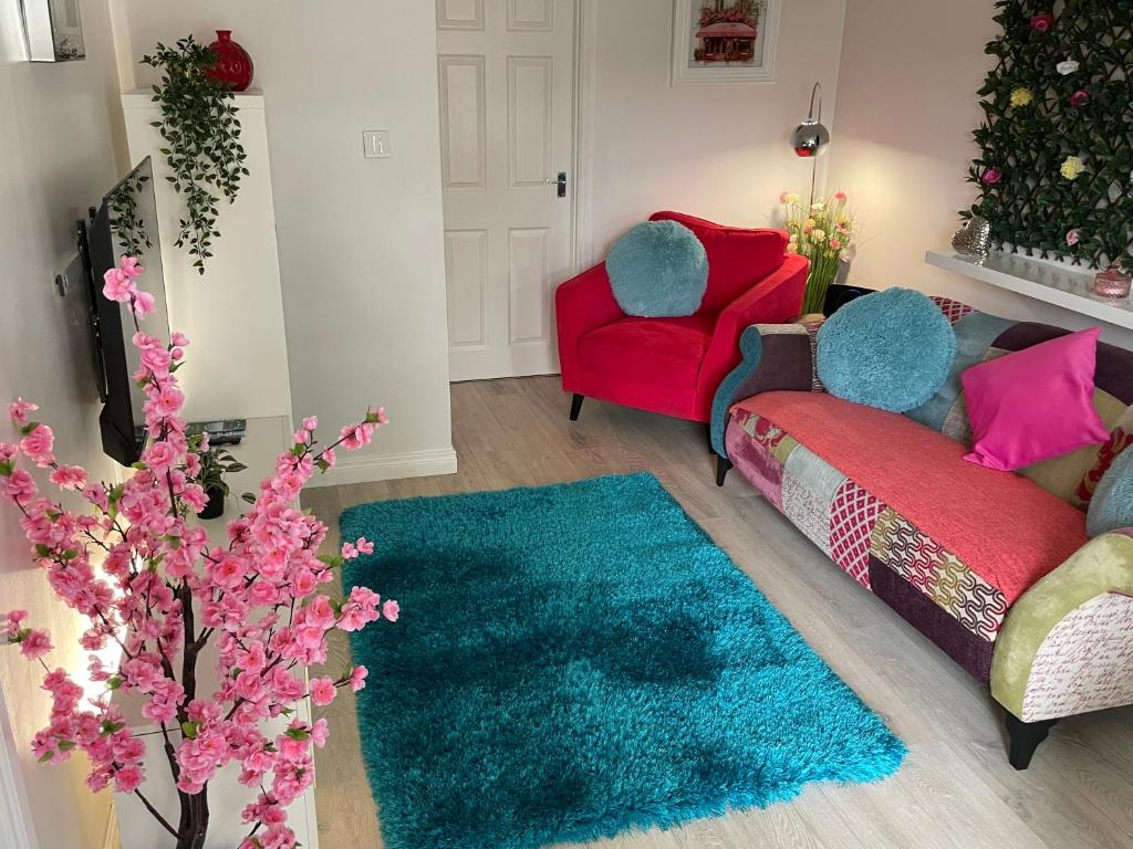 a living room with a couch and two chairs at The Courtyard in Donaghadee