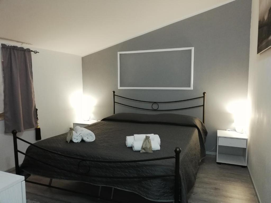Postel nebo postele na pokoji v ubytování Casa di Giorgio-fronte spiaggia