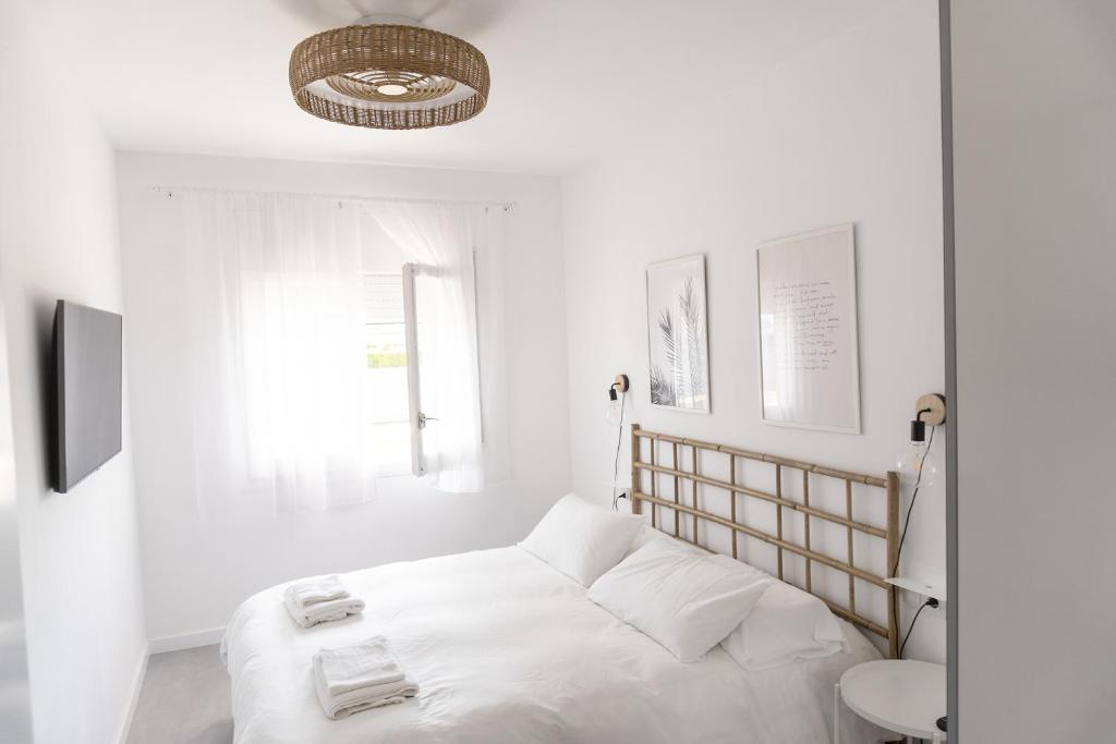 Posteľ alebo postele v izbe v ubytovaní Apartamento con Parking a 50m de la playa