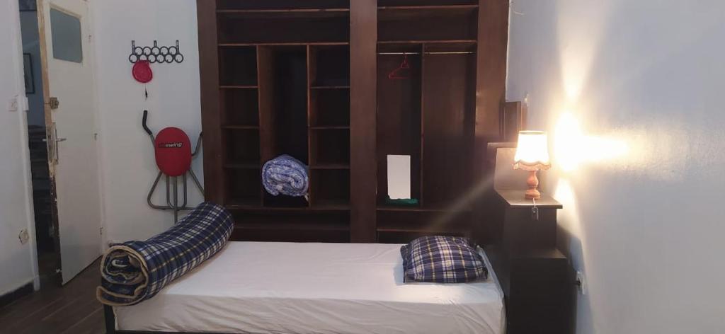 Postel nebo postele na pokoji v ubytování Chambre du jardin